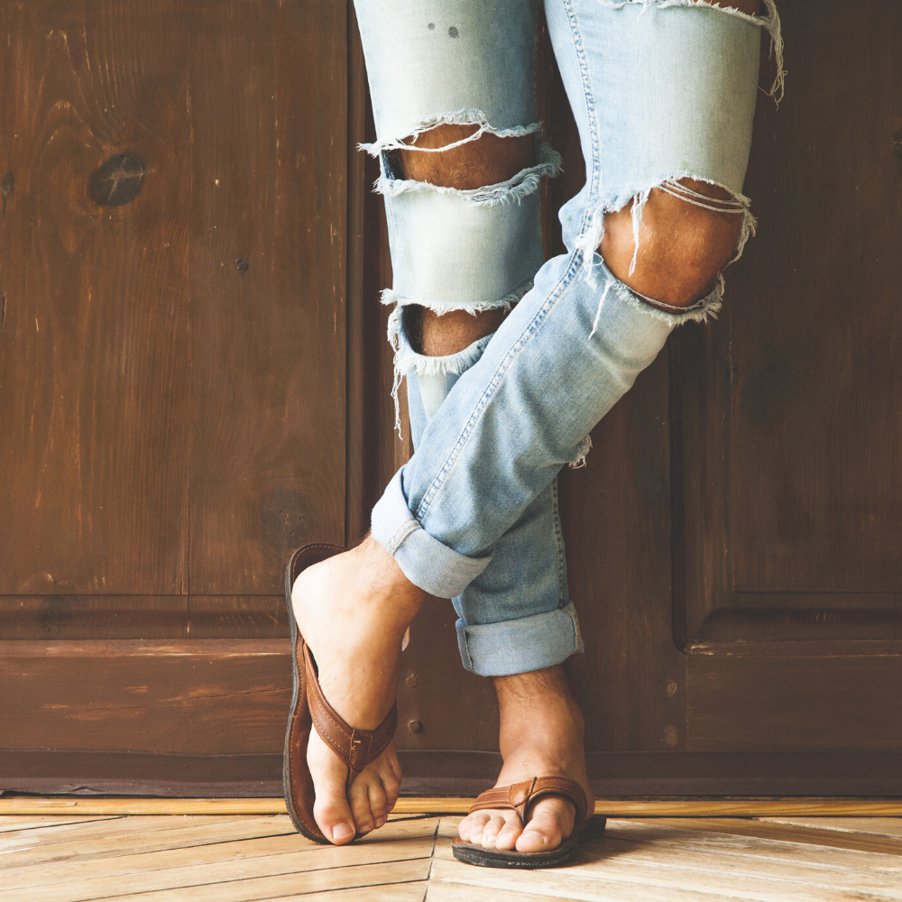 The Padre classic men's leather flip flops with handcrafted tire soles, showcasing their stylish design and comfort features.