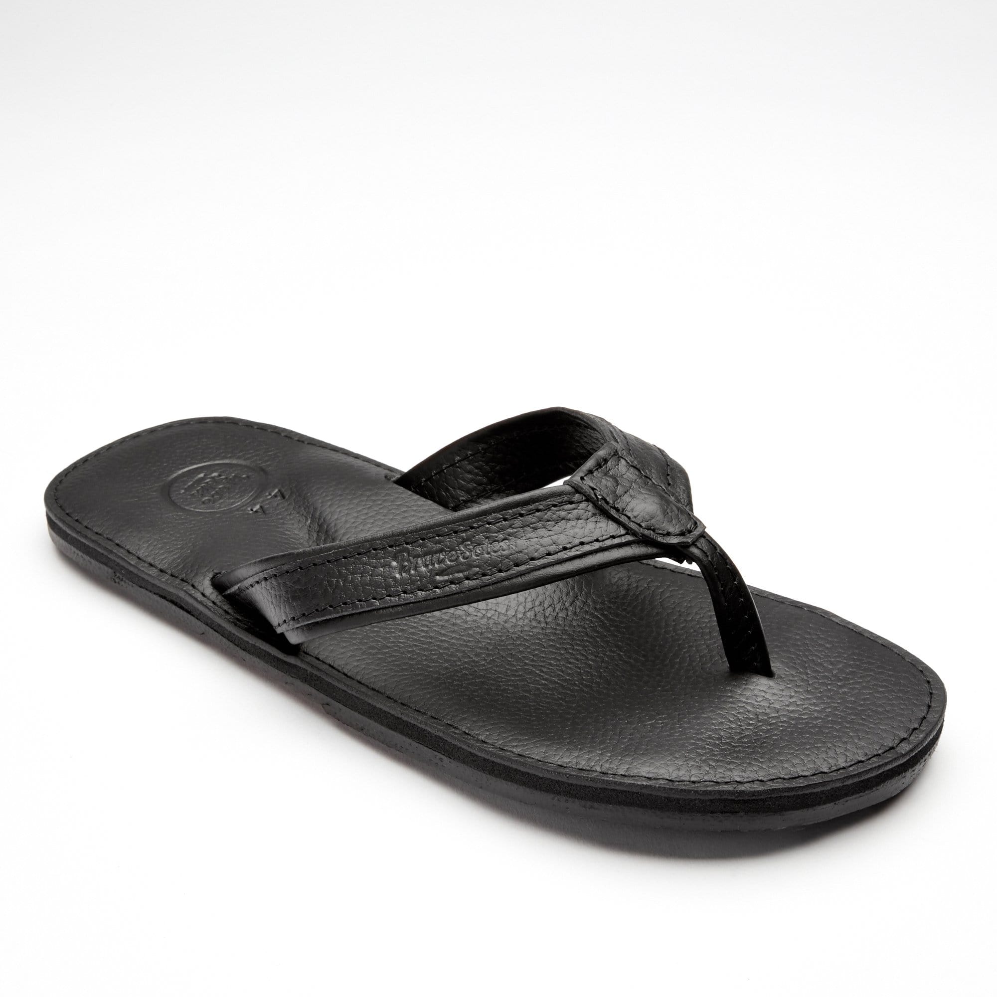 The Padre classic men's leather flip flops with handcrafted tire soles, showcasing their stylish design and comfort features.