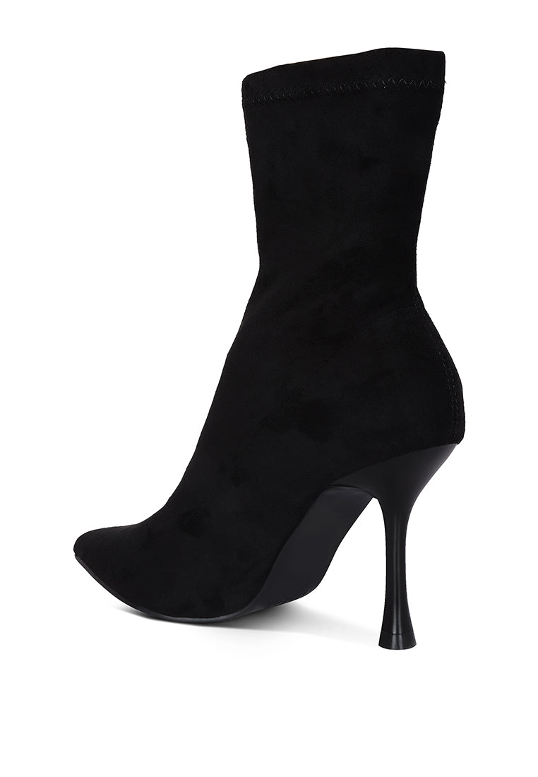 Tweeple Stiletto Boot with a pointed toe, featuring a sleek design, side zipper, and high heel, perfect for stylish women.