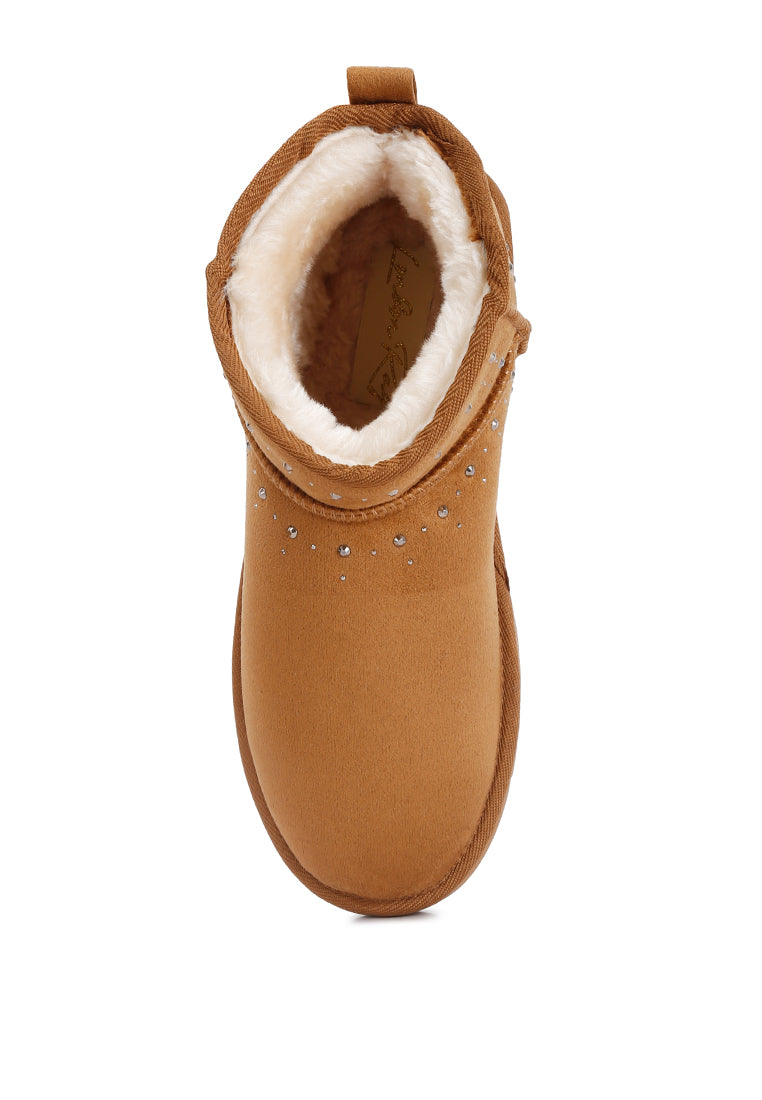 Winifred Rhinestone Embellished Fur Lined Boots featuring a suede exterior, rhinestone details, and a cozy fur lining.
