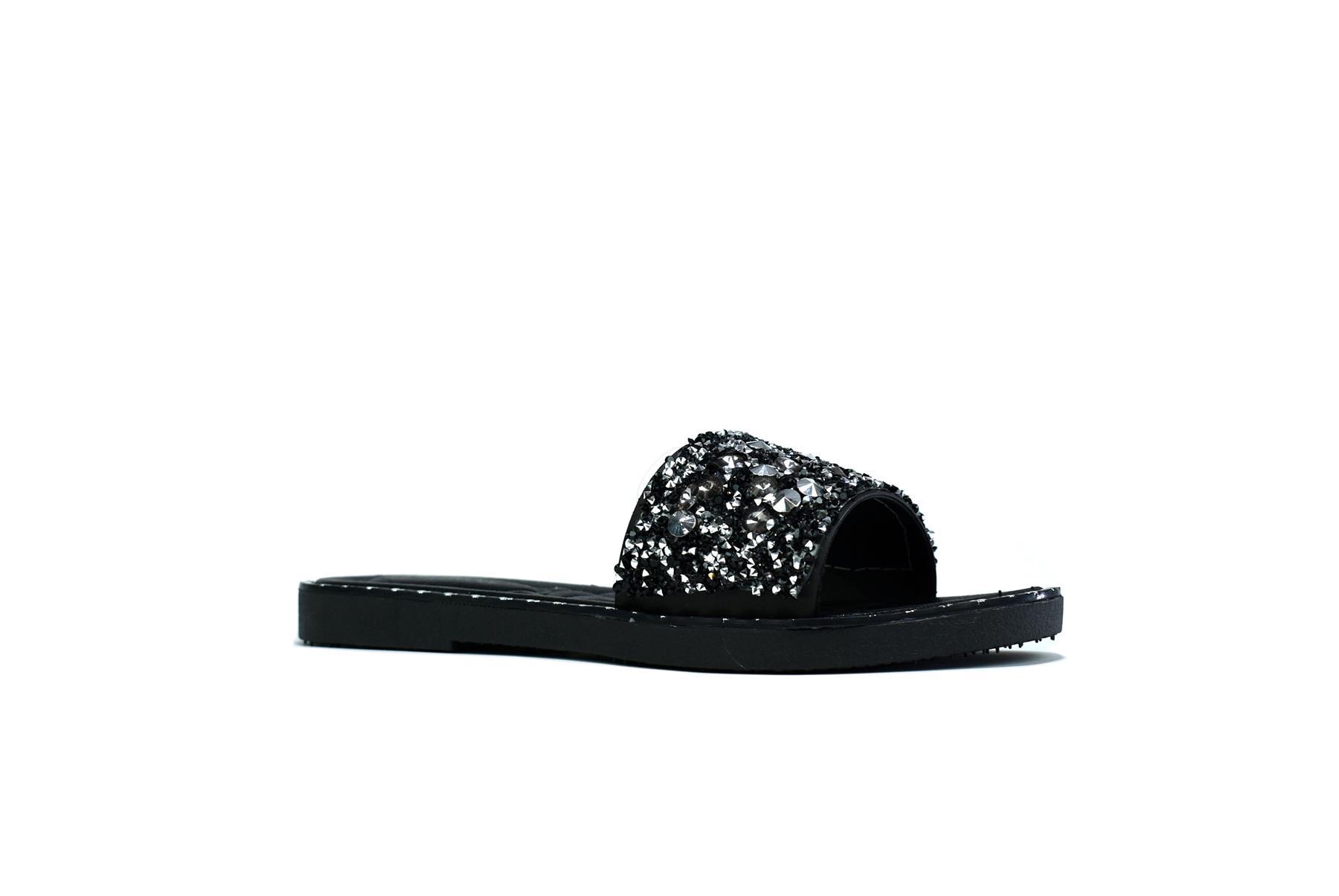 Women's black glitter sliders with a single platform design, made from synthetic PVC material, showcasing a stylish and comfortable look.
