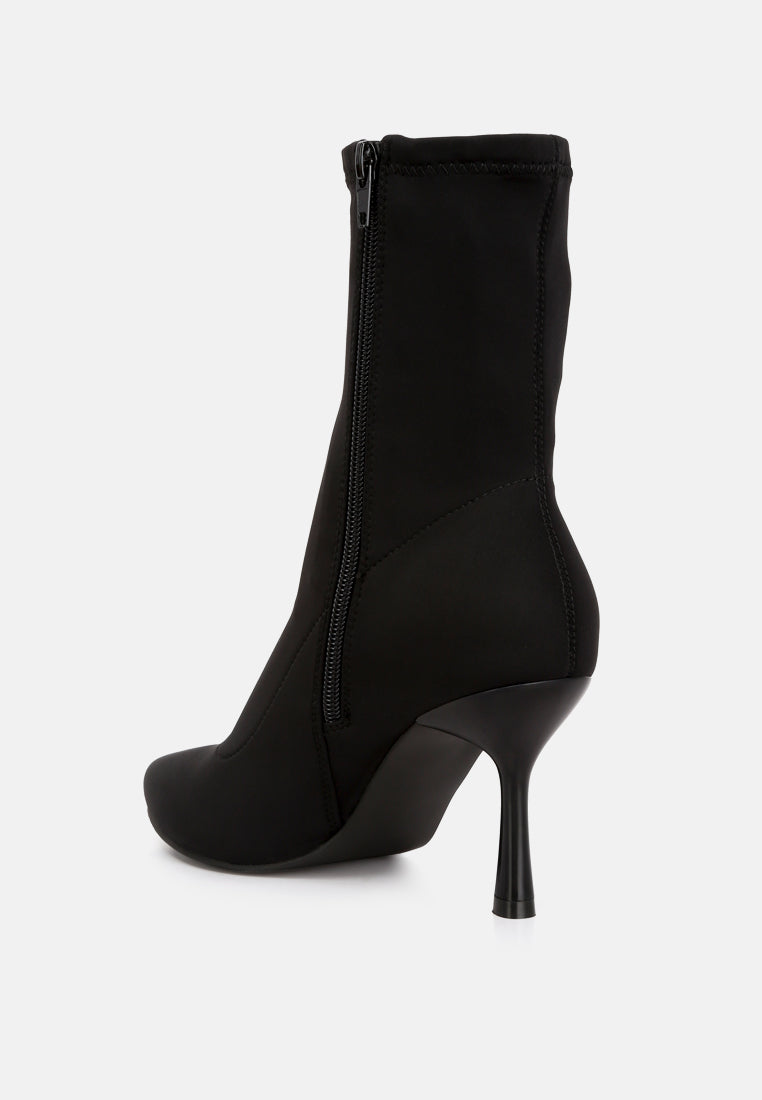 Zudio Solid Mid Heel Sock Boots featuring a lycra upper, low stiletto heel, and slip-on design, perfect for stylish comfort.