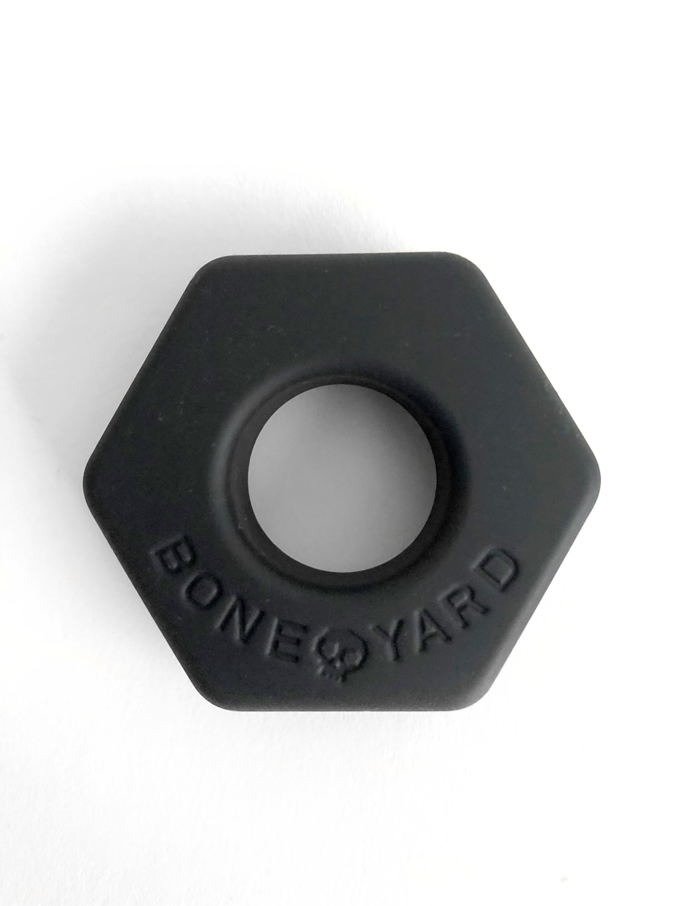 Boneyard Bust A Nut Black cock/ball ring made of soft touch silicone, showcasing its sleek design and durable stretch.