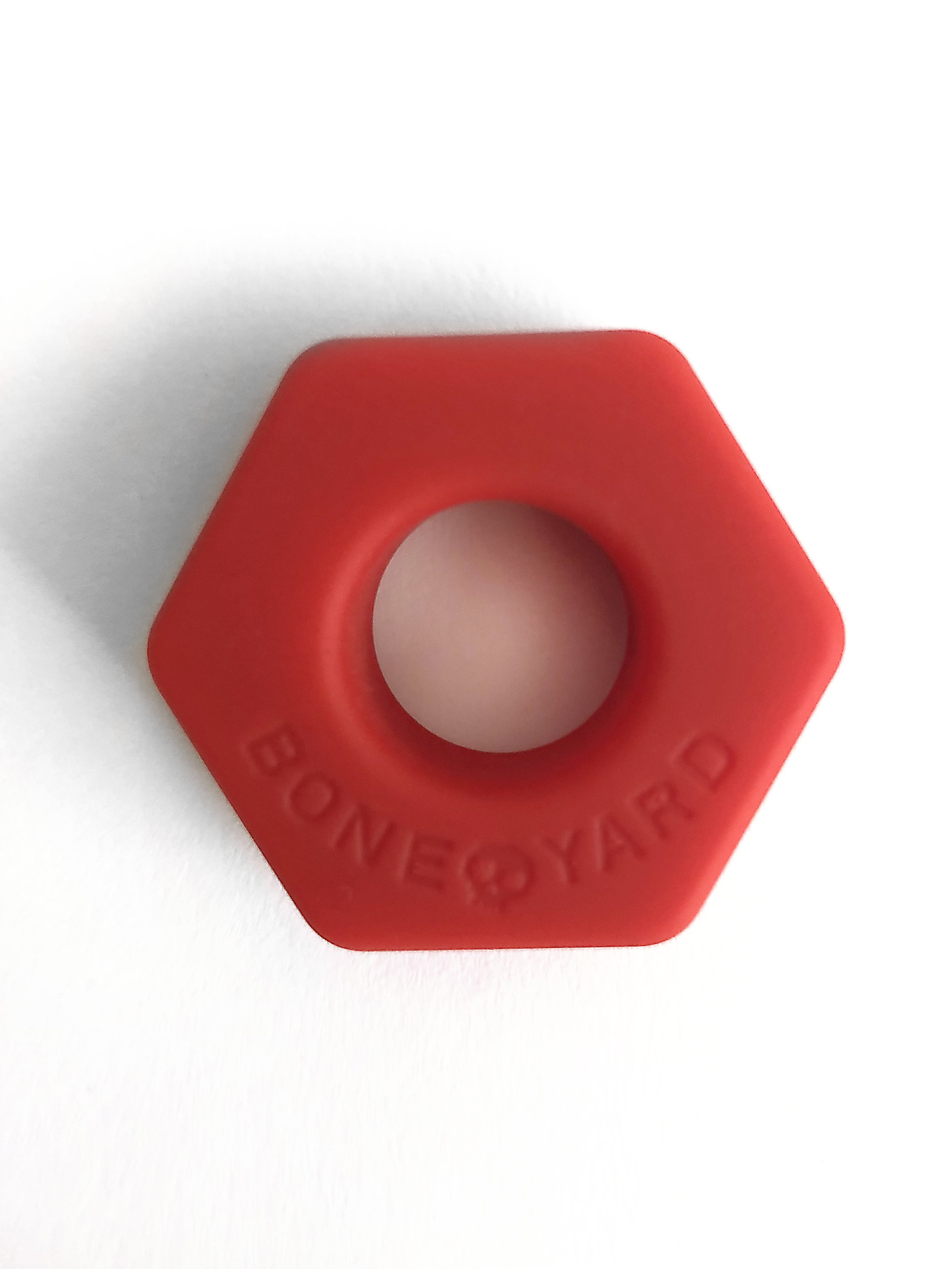 Boneyard Bust a Nut Red cock/ball ring made of soft touch silicone, featuring a sleek design and durable stretch for enhanced comfort and performance.