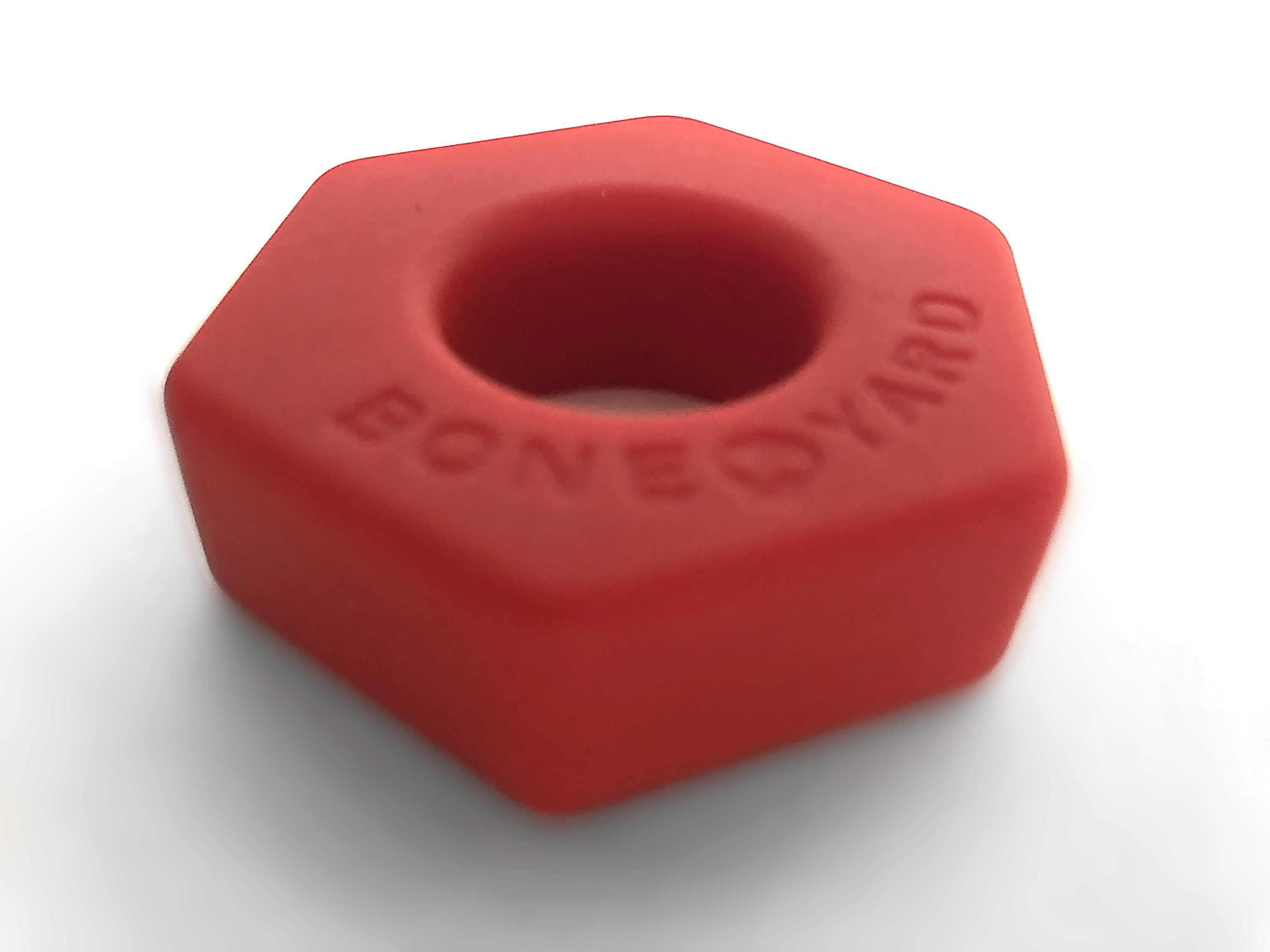 Boneyard Bust a Nut Red cock/ball ring made of soft touch silicone, featuring a sleek design and durable stretch for enhanced comfort and performance.