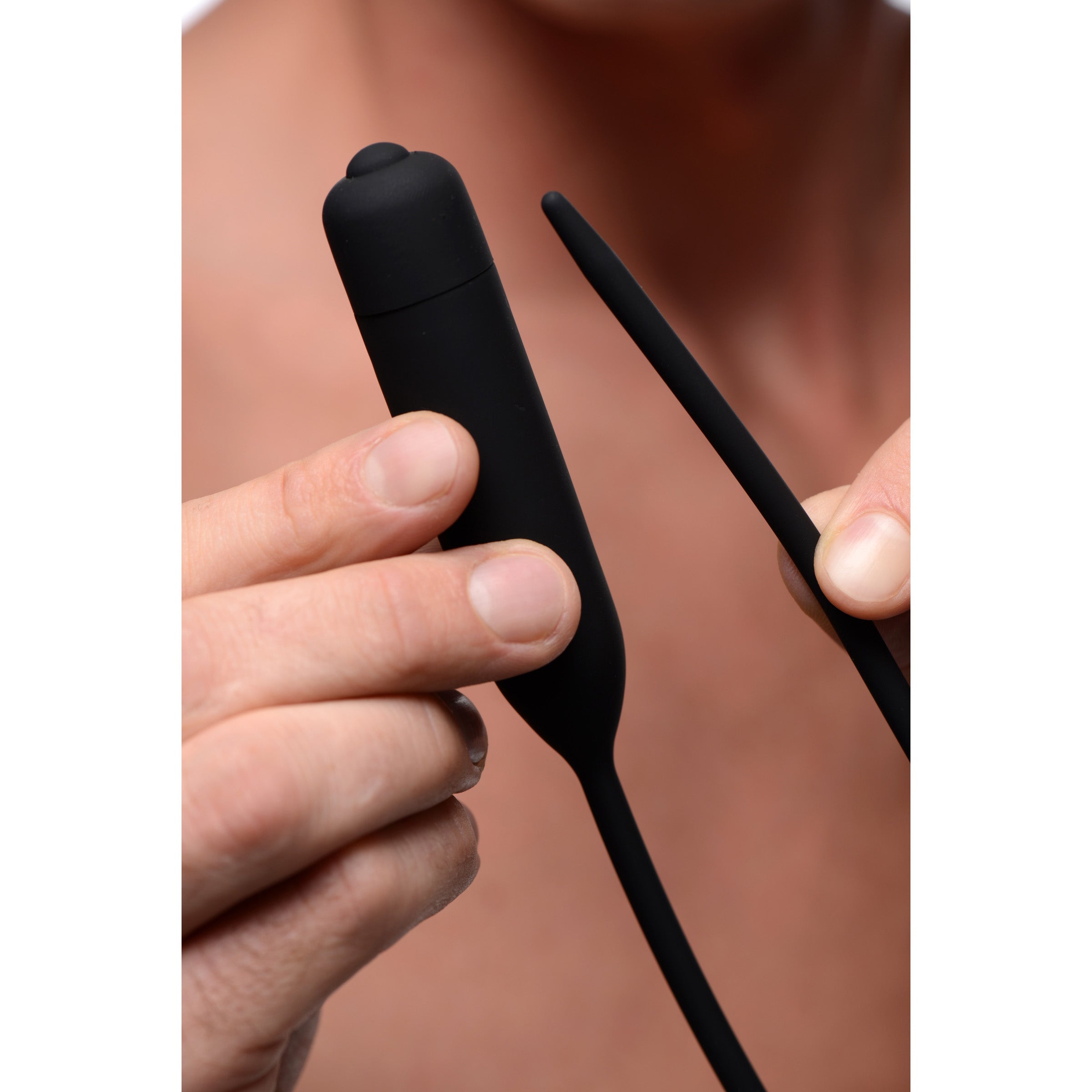 Cadence Extreme 10x Vibrating Urethral Sound in black silicone, showcasing its flexible design and insertable length.