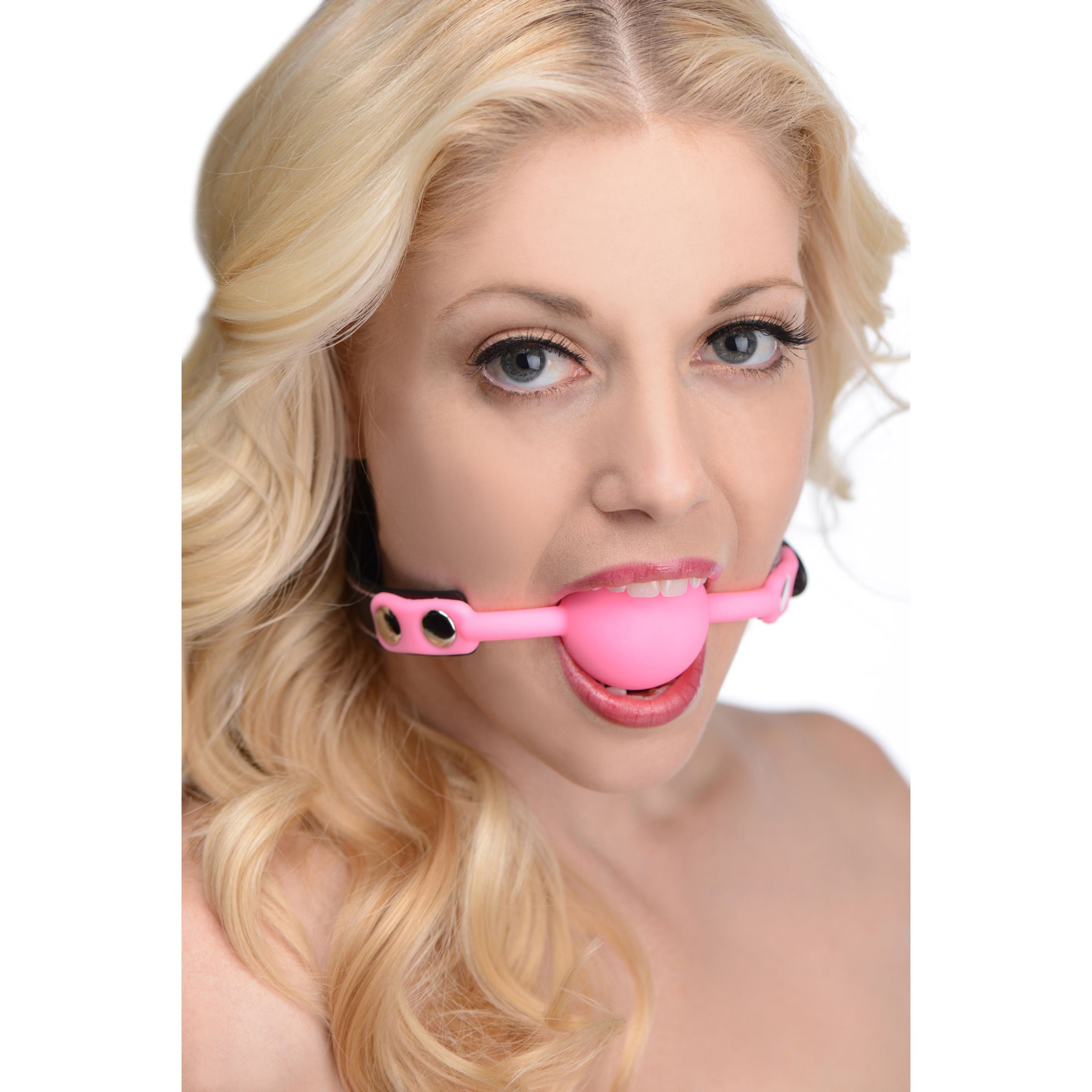 Glow Gag Glow in the Dark Silicone Ball Gag in pink, featuring a locking mechanism and adjustable straps for comfort.