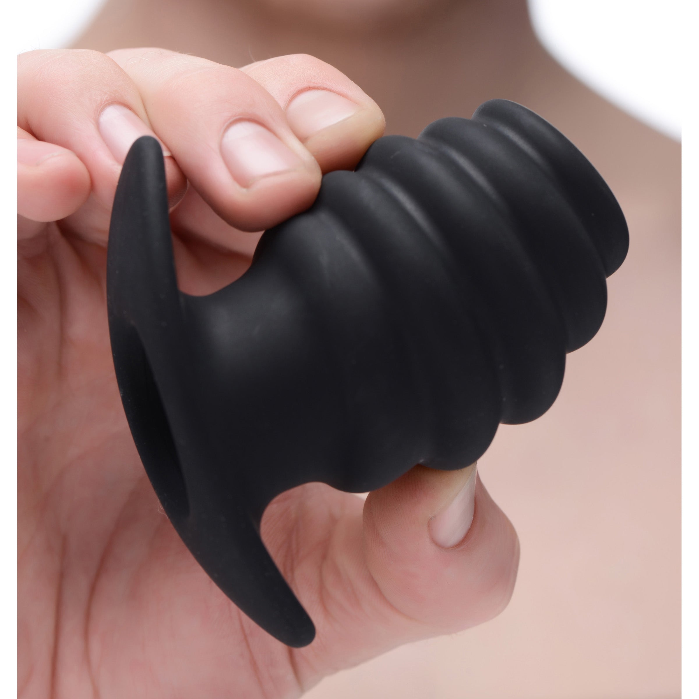 Hive Ass Tunnel Silicone Ribbed Hollow Anal Plug in black, showcasing its ribbed texture and hollow core design.
