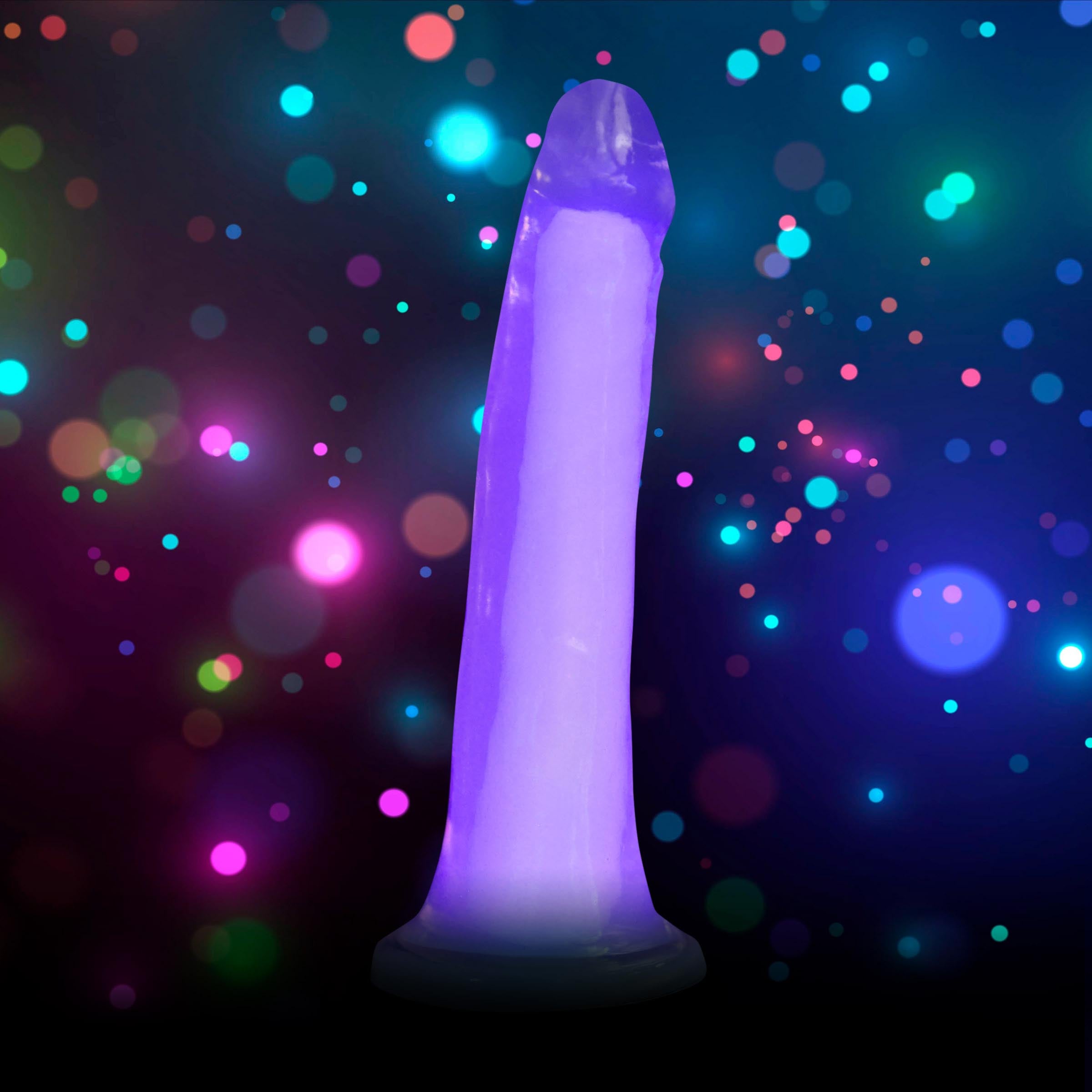 Lollicock 7" Glow-in-the-Dark Silicone Dildo in Purple, showcasing its realistic shape and flanged base.
