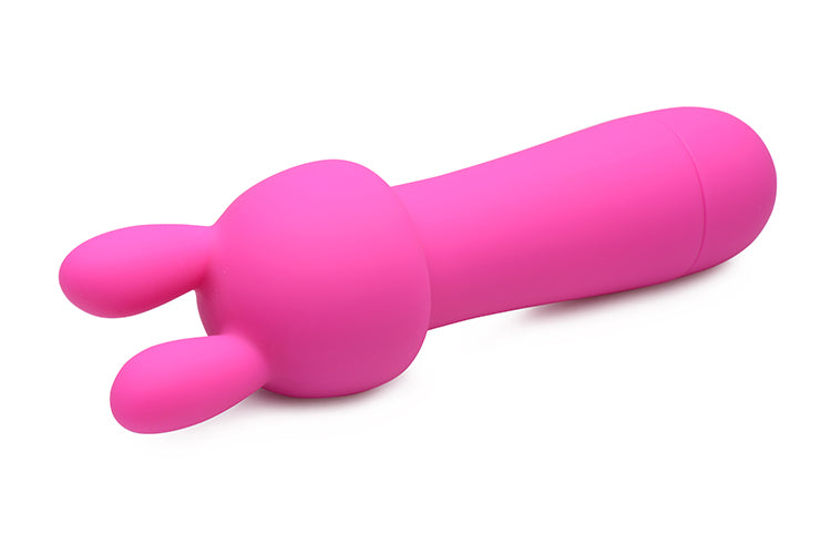 Rocket 10X Silicone Rechargeable Mini Wand in magenta with two attachments for enhanced pleasure.