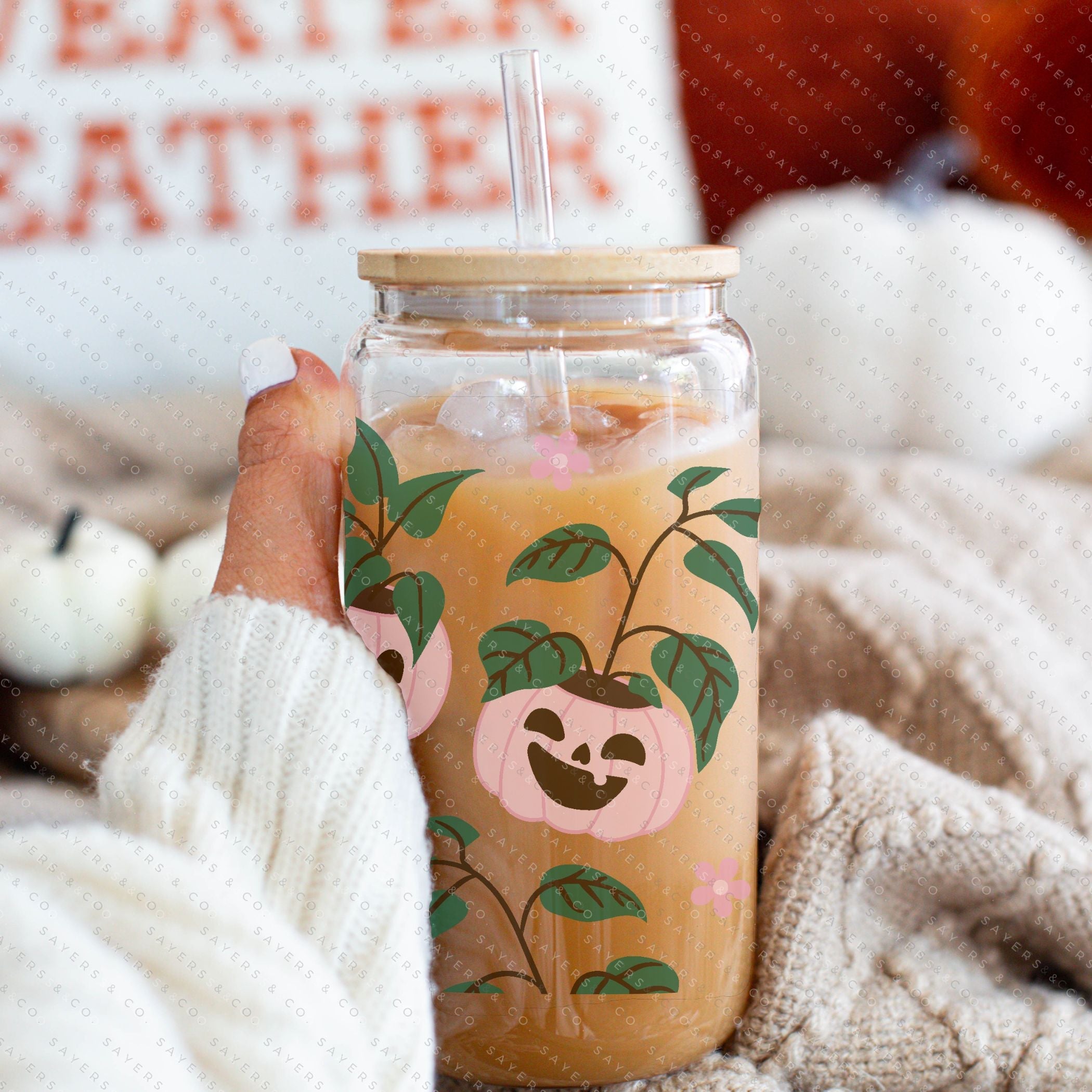 16oz Pumpkin Planters Glass Cup with bamboo lid and straw, featuring a seasonal pumpkin design, perfect for fall beverages.