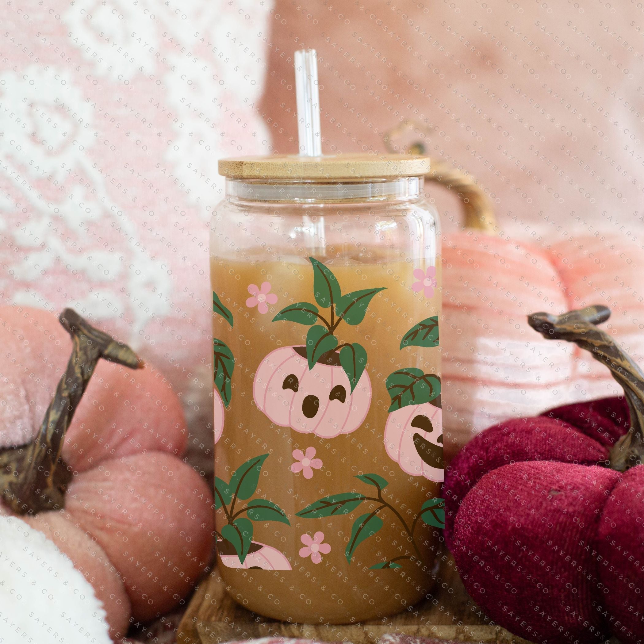 16oz Pumpkin Planters Glass Cup with bamboo lid and straw, featuring a seasonal pumpkin design, perfect for fall beverages.