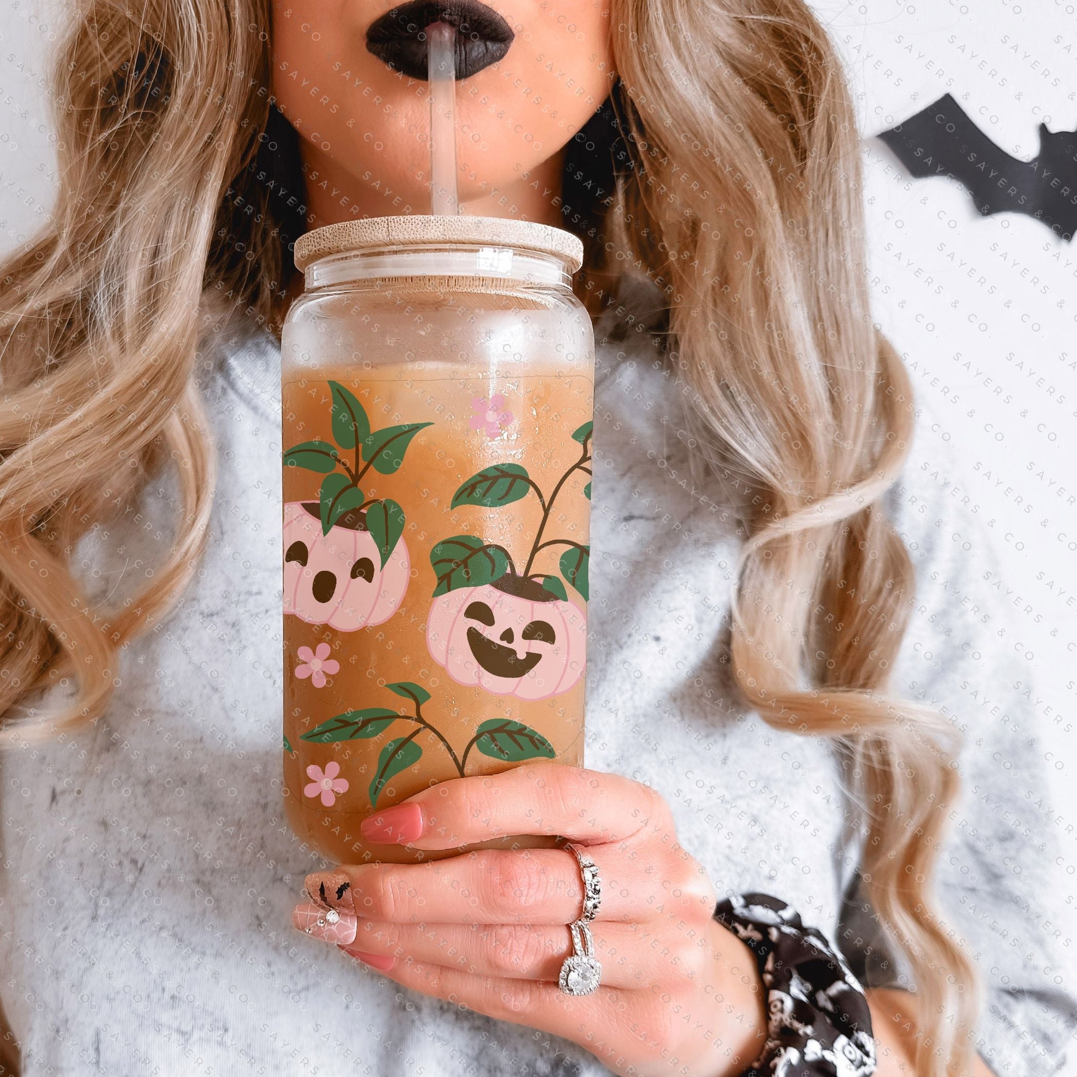 16oz Pumpkin Planters Glass Cup with bamboo lid and straw, featuring a seasonal pumpkin design, perfect for fall beverages.