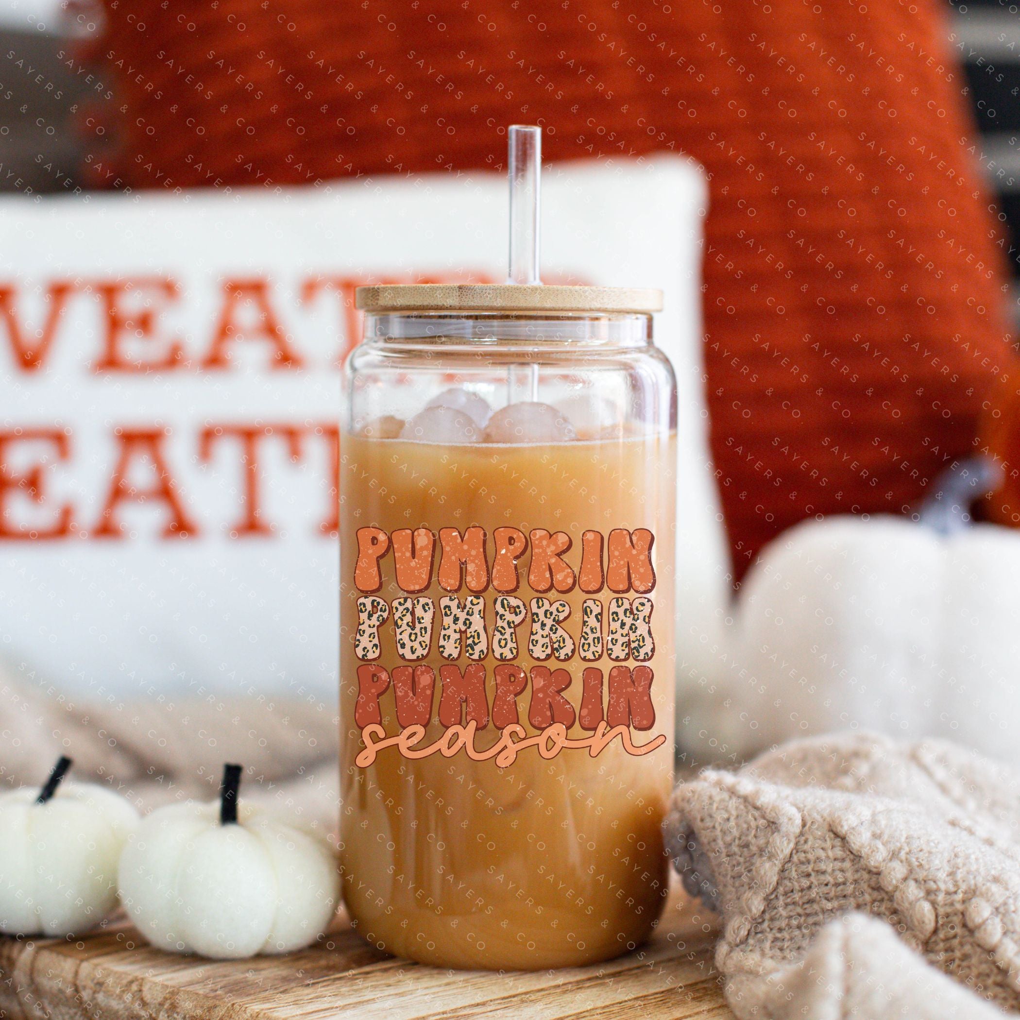 16oz Pumpkin Season Glass Cup featuring a bamboo lid and straw, perfect for fall beverages.