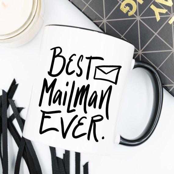 A ceramic coffee mug featuring the text 'Best Mail Man Ever' in a fun design, perfect for postal workers and coffee lovers.