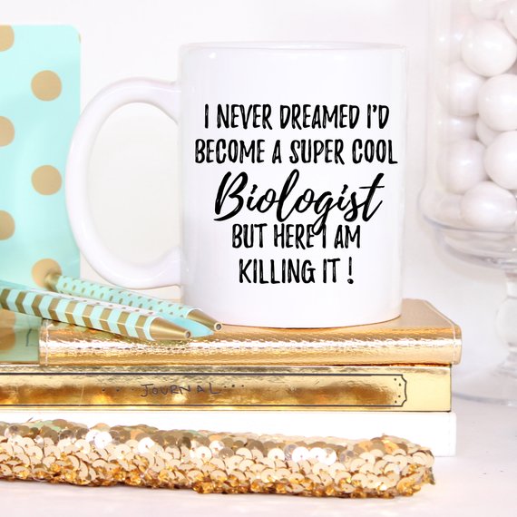 A white ceramic mug featuring a vibrant biologist-themed design, printed on both sides, perfect for coffee or tea.