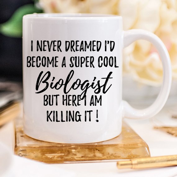 A white ceramic mug featuring a vibrant biologist-themed design, printed on both sides, perfect for coffee or tea.