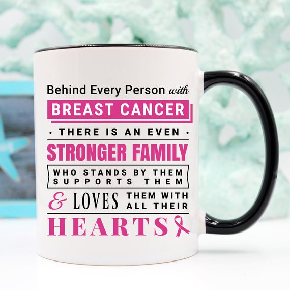 Ceramic coffee mug with a heartfelt message about breast cancer support, featuring vibrant colors and a unique design.