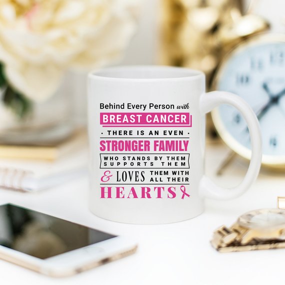 Ceramic coffee mug with a heartfelt message about breast cancer support, featuring vibrant colors and a unique design.