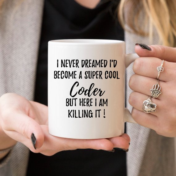 A stylish white ceramic coder mug featuring a vibrant design printed on both sides, perfect for coffee lovers and programmers.
