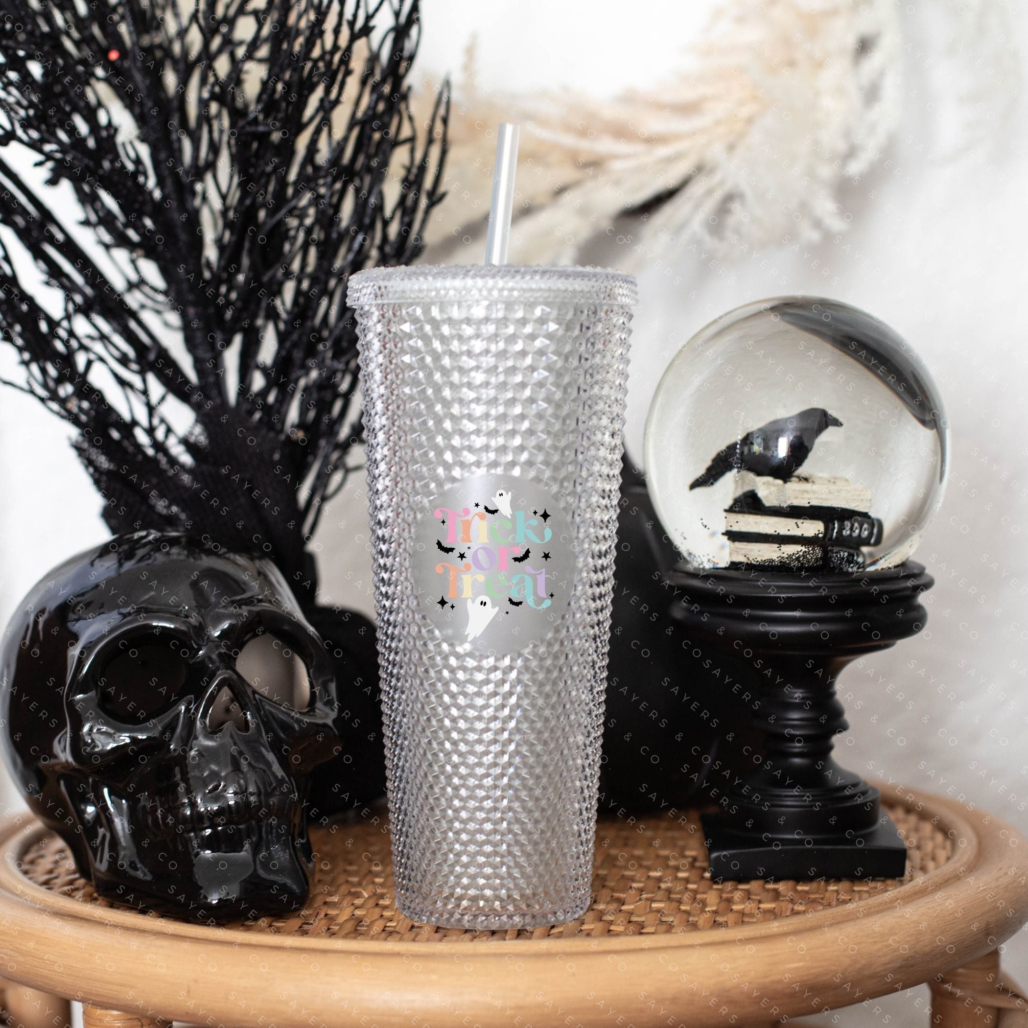Custom Studded 24oz Double Walled Tumbler featuring a spooky design, complete with a lid and straw, perfect for Halloween celebrations.