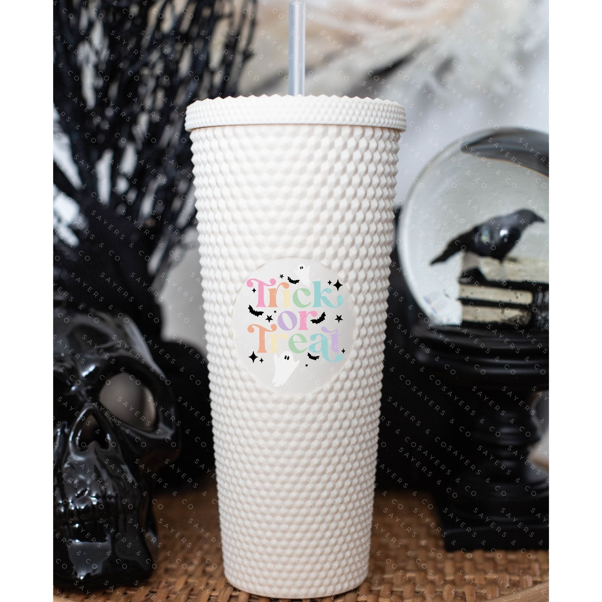 Custom Studded 24oz Double Walled Tumbler featuring a spooky design, complete with a lid and straw, perfect for Halloween celebrations.