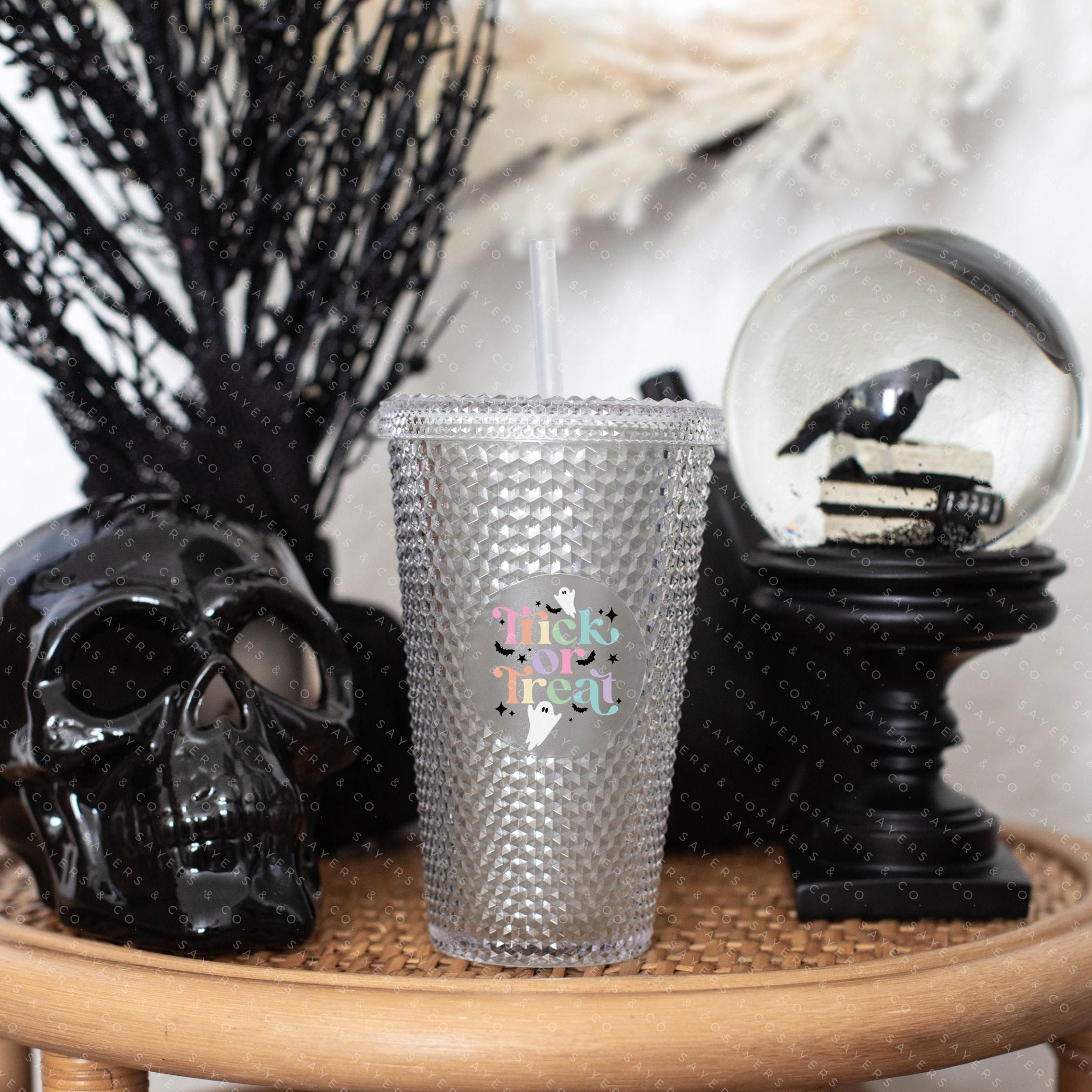 Custom Studded 24oz Double Walled Tumbler featuring a spooky design, complete with a lid and straw, perfect for Halloween celebrations.