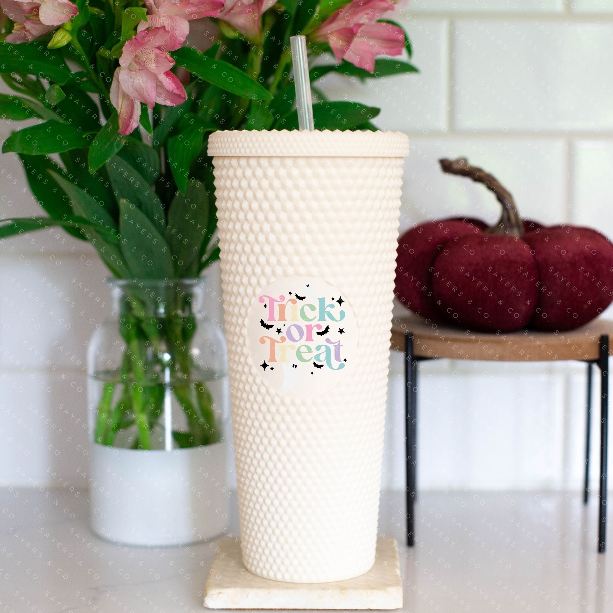 Custom Studded 24oz Double Walled Tumbler featuring a spooky design, complete with a lid and straw, perfect for Halloween celebrations.