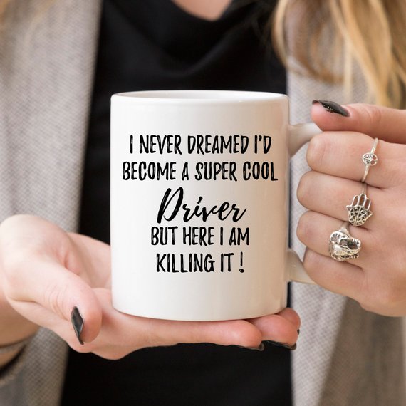 A stylish white ceramic Driver Mug featuring a vibrant design printed on both sides, perfect for coffee or tea.