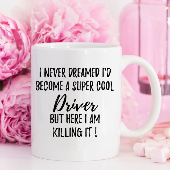 A stylish white ceramic Driver Mug featuring a vibrant design printed on both sides, perfect for coffee or tea.