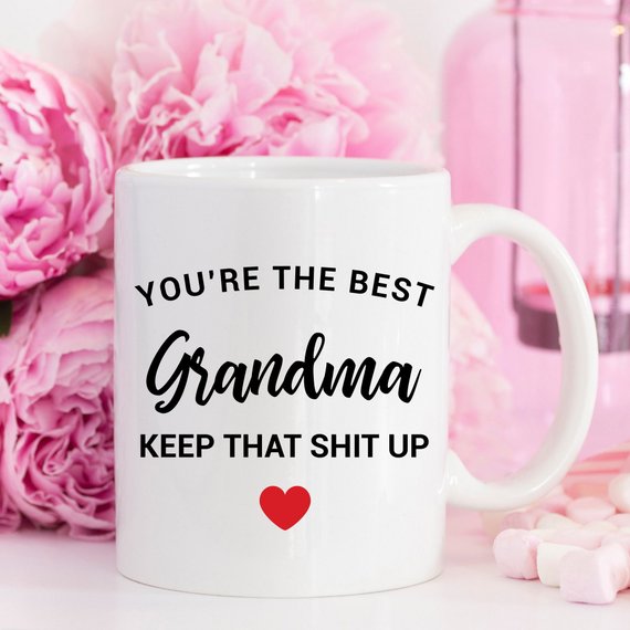 A stylish white ceramic mug designed for Grandma, featuring a vibrant printed design on both sides, perfect for coffee or tea.
