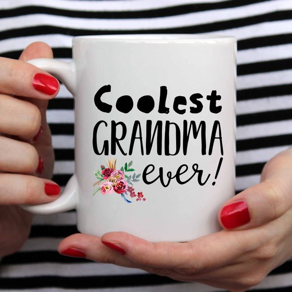 A white ceramic mug with a heartfelt design for grandmas, featuring vibrant colors and printed on both sides.