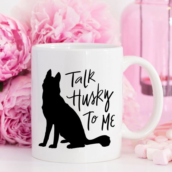 A humorous coffee mug featuring the phrase 'Talk Husky To Me', designed for dog lovers, made from high-quality ceramic.