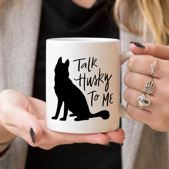 A humorous coffee mug featuring the phrase 'Talk Husky To Me', designed for dog lovers, made from high-quality ceramic.