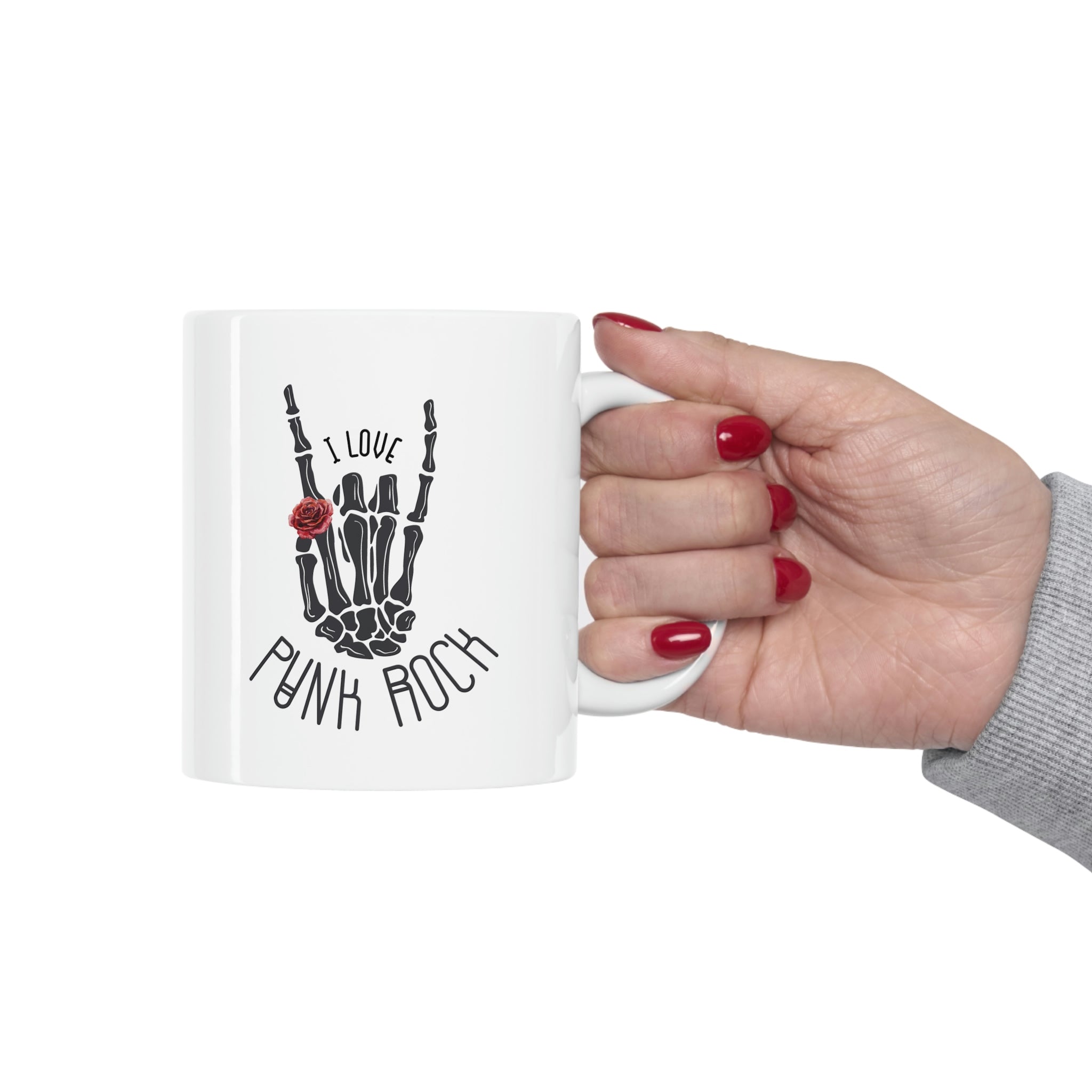 I Love Punk Rock Skeleton Hand Mug featuring a unique skeleton hand design on a white ceramic surface.