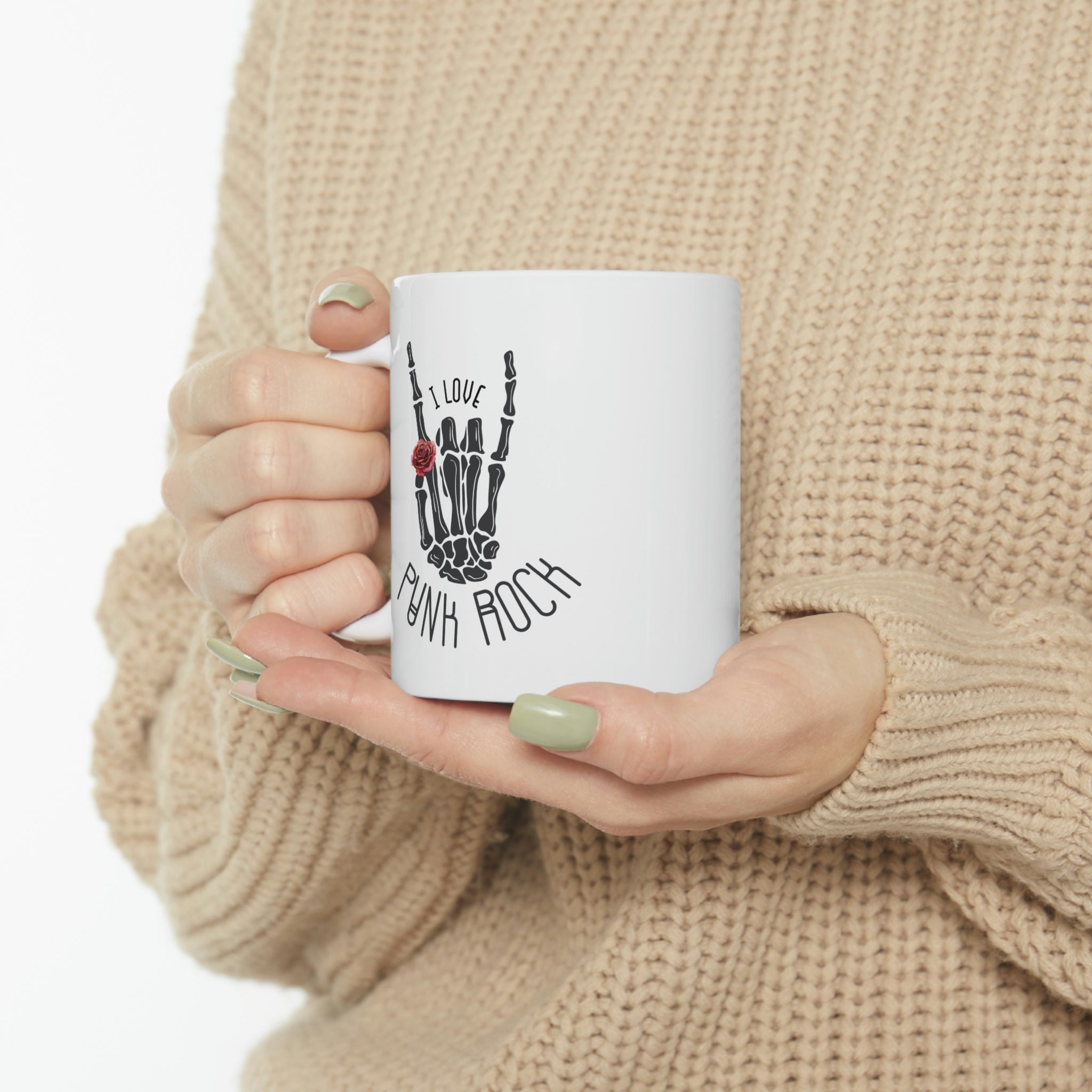 I Love Punk Rock Skeleton Hand Mug featuring a unique skeleton hand design on a white ceramic surface.