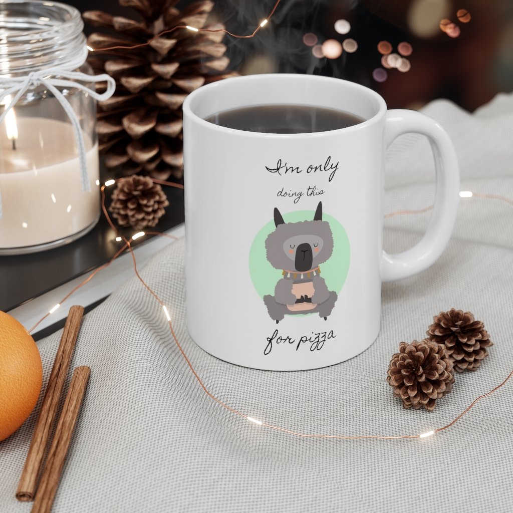 A white ceramic mug featuring a whimsical llama doing yoga, perfect for coffee, tea, and hot chocolate.
