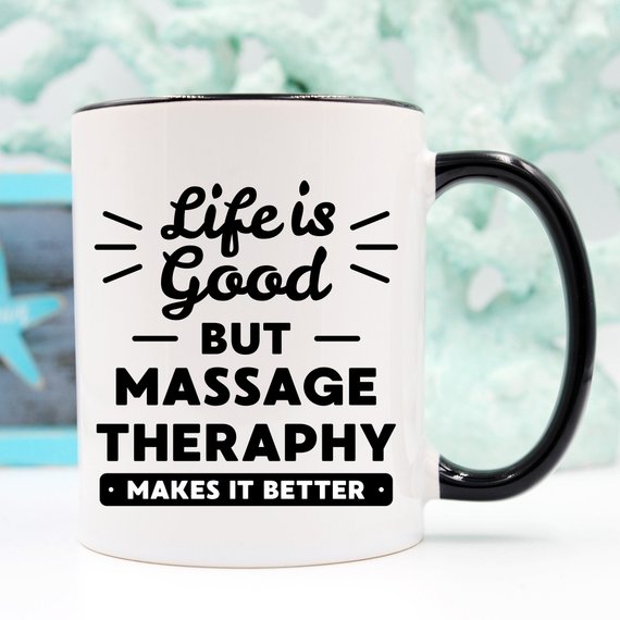 A white ceramic mug featuring a vibrant design for massage therapists, showcasing its front and back print.