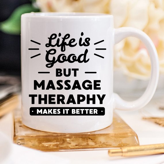 A white ceramic mug featuring a vibrant design for massage therapists, showcasing its front and back print.