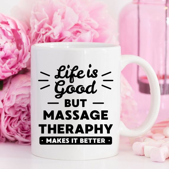 A white ceramic mug featuring a vibrant design for massage therapists, showcasing its front and back print.