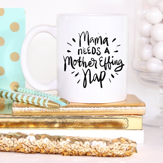 Funny coffee mug with the phrase 'Mama Needs A Mother Effing Nap' printed on it, showcasing a humorous design perfect for mothers.