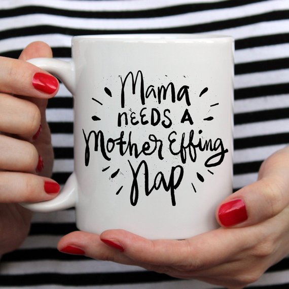 Funny coffee mug with the phrase 'Mama Needs A Mother Effing Nap' printed on it, showcasing a humorous design perfect for mothers.