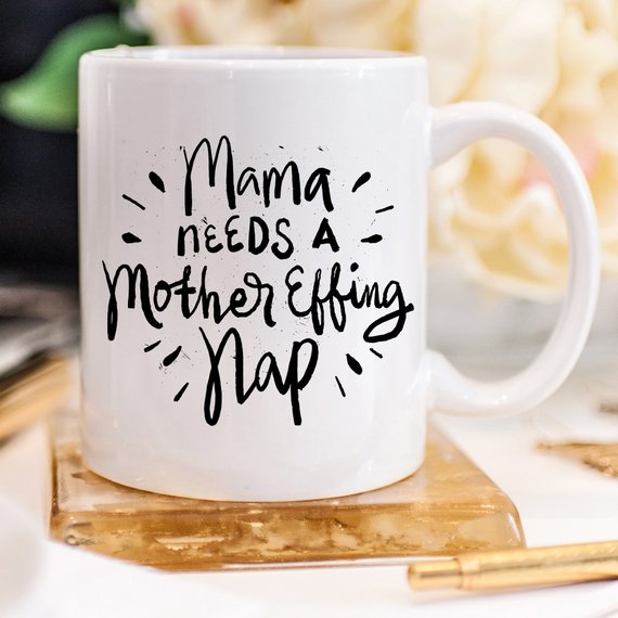 Funny coffee mug with the phrase 'Mama Needs A Mother Effing Nap' printed on it, showcasing a humorous design perfect for mothers.