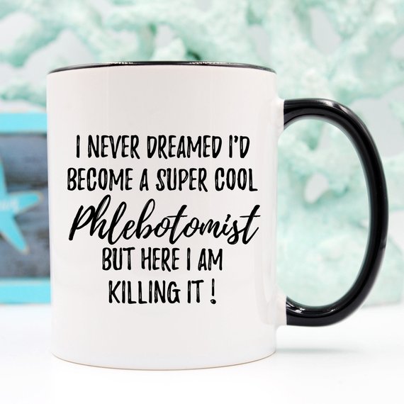 A white ceramic mug featuring a vibrant phlebotomy design, showcasing both front and back prints, ideal for medical professionals.