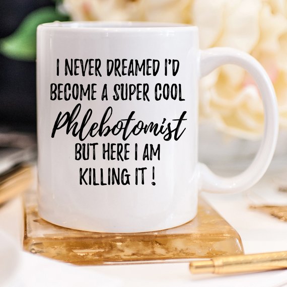 A white ceramic mug featuring a vibrant phlebotomy design, showcasing both front and back prints, ideal for medical professionals.