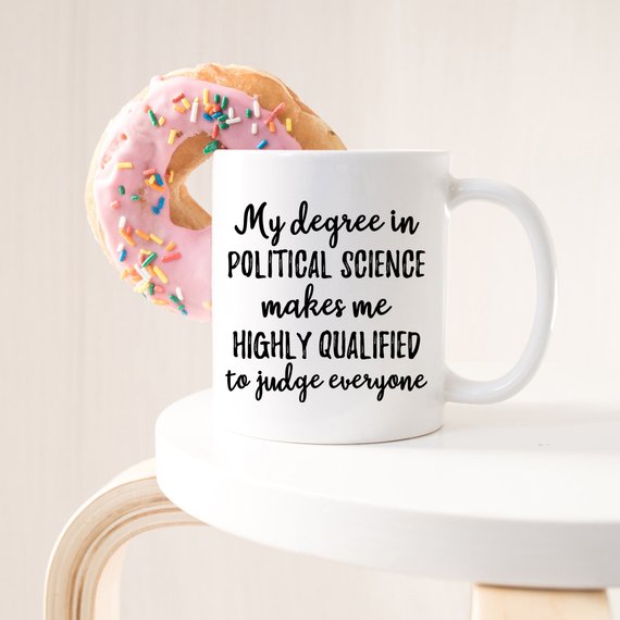 A white ceramic mug featuring a vibrant political science design printed on both sides, perfect for coffee or tea.