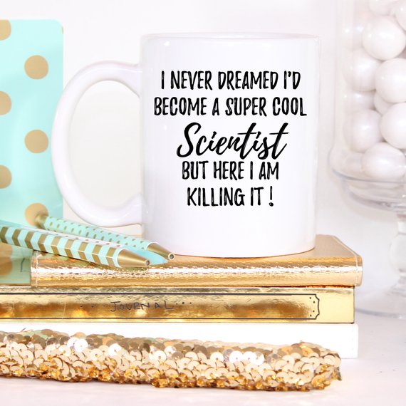 A white ceramic Scientist Mug featuring a vibrant design printed on both sides, perfect for coffee or tea.