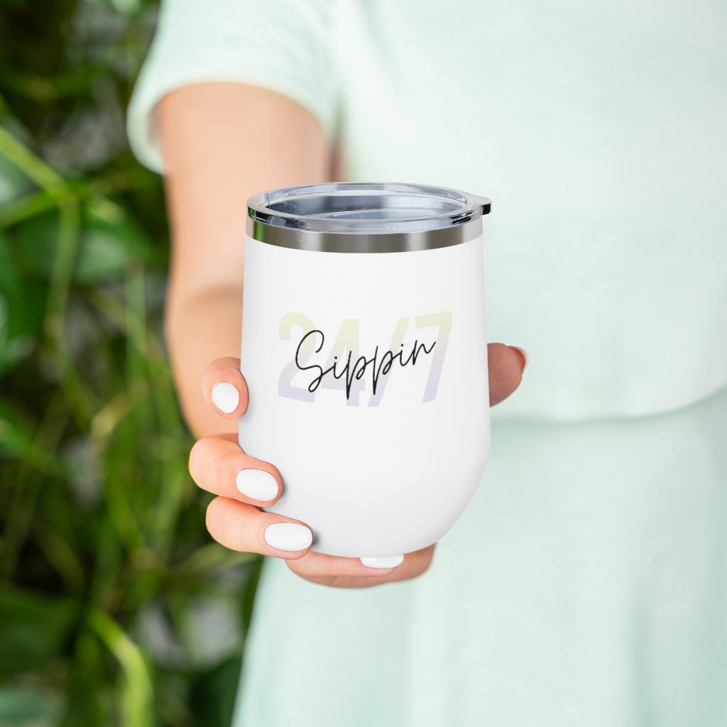 Sippin Insulated Wine Tumbler in white with clear lid, showcasing its sleek design and double-wall insulation.