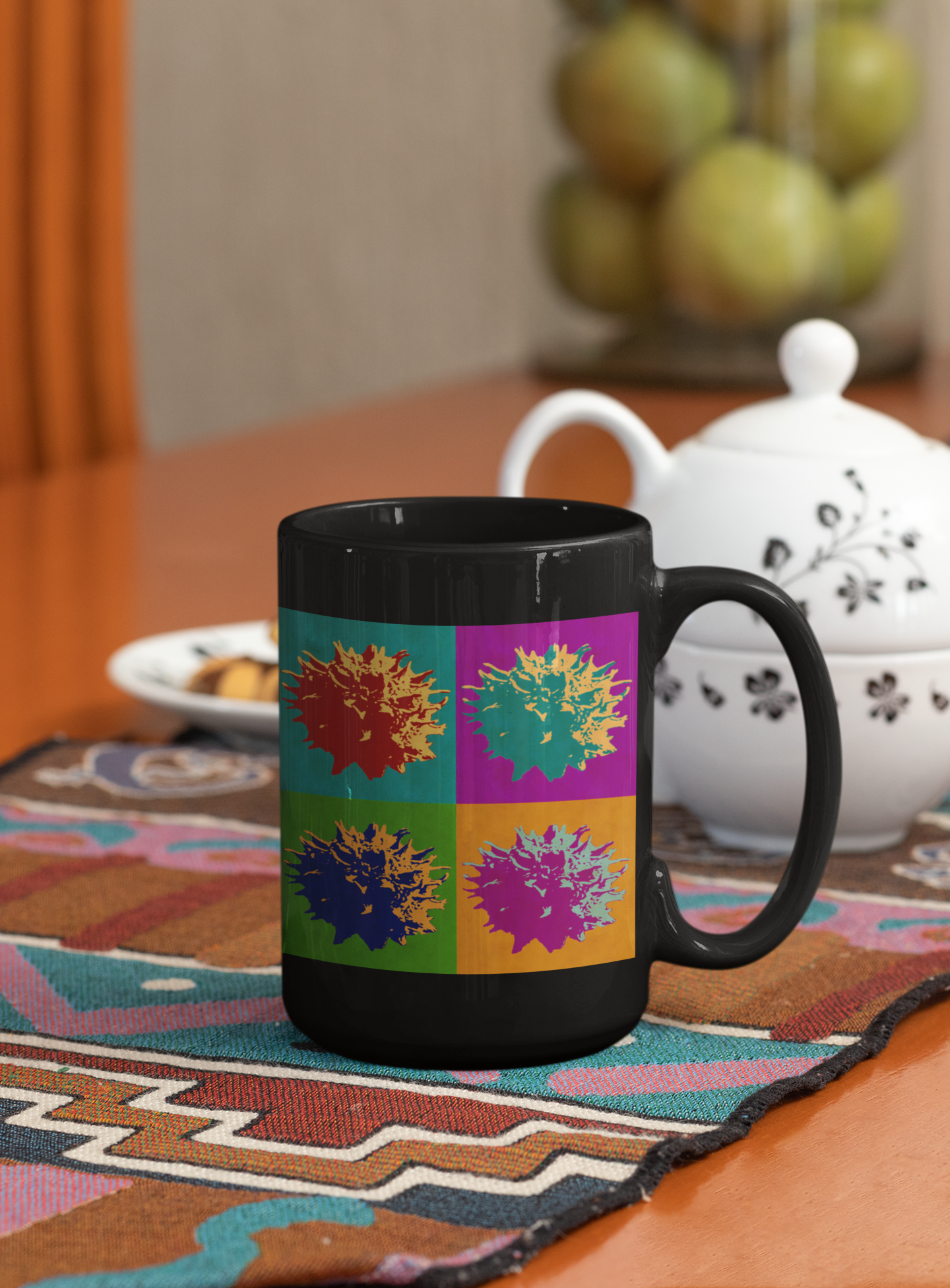 A stylish ceramic coffee mug featuring a vibrant abstract pop art design, available in white and black colors.