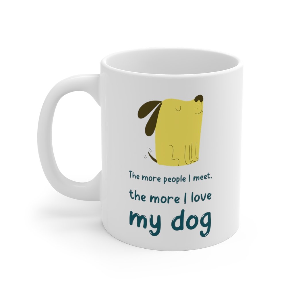 A white ceramic mug with the phrase 'The More People I Meet, The More I Love My Dog' printed on it, showcasing a classic design.